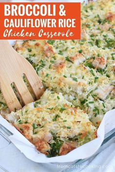 broccoli and cauliflower rice chicken casserole in a baking dish with a wooden spatula