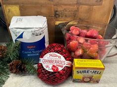 strawberries, pine cones and other ingredients are on the counter