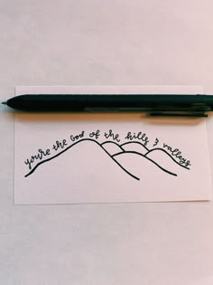 a pen sitting on top of a piece of paper with the words you're the best of the hills