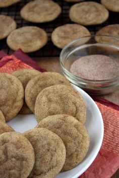 some cookies are on a plate next to a bowl