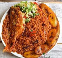 a white plate topped with rice covered in meat and veggies next to banana slices