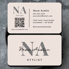 two business cards sitting on top of each other with the letter n in black and white