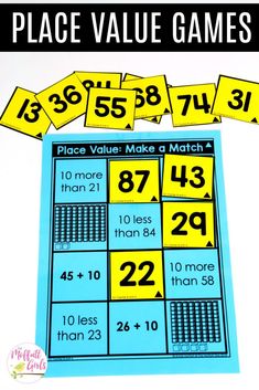 place value math game with yellow and blue numbers on the top, in front of it