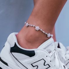 Introducing the Daisy Anklet, an eye-catching accessory for any occasion! Featuring a row of small pave daisies with pink crystal center stones along a delicate chain, this anklet is crafted in 14k White Gold for a luxurious finish. Whether you're walking on the beach or dressing up for a night out, this piece is the perfect finishing touch to your look. Pair it with the Daisy Stud Earrings to complete the matching set! This product is guaranteed for life – GLD will repair or replace the item sh Daisy Anklet, Walking On The Beach, Forever Products, Daisy Studs, Women Anklets, Adjustable Weights, Vermeil Jewelry, Delicate Chain, Custom Earrings