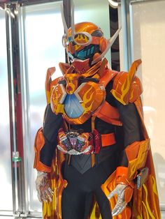 an orange and black costume is on display