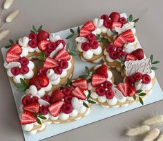 a number shaped cake with strawberries on top