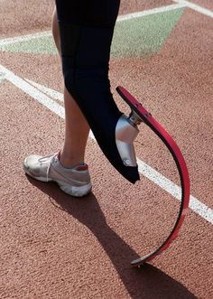 a person standing on top of a tennis court holding a racquet in their hand