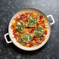 a pan filled with food on top of a table