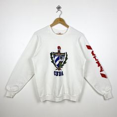 90s Cuba Crewneck Sweatshirt Print Logo White Color Men's L - Made in Usa - Materials : Cotton, Polyester  - Tag Reads : L Kindly see the actual measurements (All measurements were taken lying flat) - Actual size manual measurements * Width (Armpit to armpit) : 22 inches * Length (Shoulder to end of garment) : 26 inches * Sleeve length : 23 inches - Condition : * Vintage condition 8/10 (80%) * Minor stain refer picture  * Free from tear and major defect - Shipping : * DHL Express/FedEx Express = 3-6 business day arrived * Please PROVIDE your PHONE/CONTACT NUMBER for SHIPPING/DELIVERY purpose DON'T FORGET TO VISIT MY SHOP FOR MORE GREAT STUFF, THANK YOU. 90s Style White Crew Neck Sweater, White Crew Neck Sweater In 90s Style, White 90s Crew Sweatshirt, White Crew Neck 90s Sweatshirt, 90s White Crew Sweatshirt, White 90s Crew Neck Sweatshirt, 90s Style White Cotton Sweater, White Cotton 90s Style Sweater, 90s White T-shirt For Winter