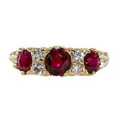 A Beautiful Classic VICTORIAN revival Trilogy Diamond Ring with Three SUPER RARE Gorgeous Ruby, create a hypnotic radiance and luster with splash of color.Three bright faceted antique Oval Rubies are beyond words!! A NATURAL, NO HEAT in Deep Pigeon Blood Vivid Red Transparent Color from from Thailand (formerly Siam), glistens and glows in between 2 vertically set round diamonds. Totaling just under 2cts (approx. 1.80 ctw). Measuring from 4.53x3.72x2.11 to 5.45x4.78x3.09mm. Accompanied by gemolog Fine Jewelry Red Diamond Three Stone Ring, Heirloom Three Stone Red Rings, Heirloom Red Diamond Ring With Brilliant Cut, Heirloom Brilliant Cut Red Ring, Heirloom Red Brilliant Cut Ring, Trilogy Diamond Ring, Victorian Revival, Right Hand Rings, Beyond Words