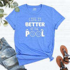 "Life Is Better at the Pool Shirt, Funny Pool T-Shirt, Vacation Shirt, Weekend Shirt, Holiday Shirt, Beach Summer Shirt, Women's Pool Shirt. HI! Welcome to my store, I'm delighted to see you here. My store's main goal is to provide you with premium everyday apparel with the best graphic t-shirts. I see you as a friend, not just a customer. I'm sure you'll love my designs. You can order the same design 4XL and 5XL large sizes from the link, please specify the details in the order note.   https:// Swim Clothes, Pool Shirts, Custom Pools, Pool Time, Swimming Outfit, Holiday Shirt, Vacation Shirts, Nursing Shirts, Holiday Shirts