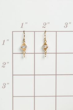 A beautiful gift for those born in April, featuring their birthstone of stunning quartz that is hand wrapped in gold filled wire. These feminine earrings dangle from gold filled earwires. Gold Filled (lead and nickel free) Quartz .75", on gold filled earwires We hand select our natural materials, thus there may be slight variations in color and/or size that will not detract from the overall aesthetic Our unique handcrafted designer jewelry for women is made in America, with each design created i Delicate Wire Wrapped Yellow Gold Earrings, Gold Dainty Crystal Earrings For Anniversary, Dainty Gold Crystal Earrings For Anniversary, Delicate Yellow Gold Wire Wrapped Earrings, Delicate Gold Wrap Earrings, 14k Gold Filled Wire Wrapped Drop Earrings, Gold Teardrop Hypoallergenic Crystal Earrings, Gold Plated Wire Wrapped Gold Earrings, Gold-plated Wire Wrapped Earrings