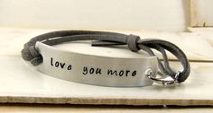 "SHIPS IN 2 DAYS as shown in the photo. Stamped \"love you more\" with the color options in the listing. If you want a custom stamped bracelet you can order from the following listing. Great last minute gift! Large orders will take longer. https://www.etsy.com/listing/119903464/love-you-more-bracelet-stamped-leather?ref=listings_manager_grid \"Love You More\" hand stamped on lightweight aluminum blank with a leather lace looped on one end attached to a lobster clasp which connects to the bracele Faux Leather Bracelets, Handstamped Bracelet, Bracelet Quotes, Stamped Leather, Stamped Bracelet, Custom Bracelet, Personalized Bracelet, Hand Stamped Jewelry, Personalized Bracelets