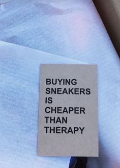 a piece of paper that says buying sneakers is cheaper than therapy on it