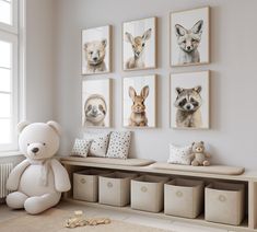 a teddy bear sitting in front of four pictures on the wall with animals hanging above it