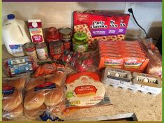 an assortment of food items sitting on top of a counter