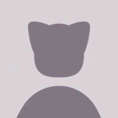 the silhouette of a cat's head is shown against a gray background