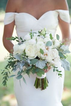 a woman holding a bouquet of flowers on her wedding day, instagrams from instagram com