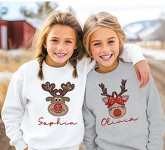 D E S I G N Your little one will be ready for all their Holiday events in this trendy Christmas sweatshirt. Made with a comfortably balanced blend of 50% cotton and 50% polyester, the sweatshirt is the perfect choice for school, sports, and lounging with friends. Its medium-heavy fabric delivers a cozy, warm feeling while each sweatshirt runs true-to-size for a great fit. Design: Personalized Reindeer Christmas Sweatshirt features faux glitter/sequins and embroidery print S I Z I N G Youth Crewneck Sweatshirt XS(5) S(6/8) M (10/12) L (14/16) D E T A I L S 50% cotton, 50% polyester Medium-heavy fabric  Loose fit Machine wash cold, inside-out, gentle cycle with mild detergent and similar colors. No fabric softeners. Tumble dry low, or hang-dry for longest life. Cool iron inside-out if necess Merry And Bright Shirt, Christmas Merry And Bright, Christmas Youth, Name Sweatshirt, Reindeer Shirt, Christmas Shirts For Kids, Embroidery Print, Nana Shirts, Holiday Events