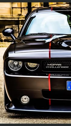 the front end of a black sports car