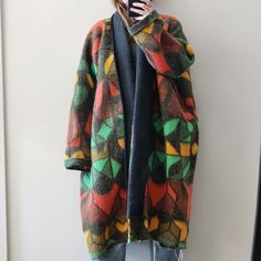 "This one of a kind coat has been upcycled from a vintage, super warm and cozy blanket. The fiber content is unknown, I would guess that it is not 100% wool. The fabric does have some give, but technically no stretch and the design is unlined.  Body is approximately 32\" across from chest to hem. Sleeves are approximately 16\" from drop shoulder to cuff. Fits women's size Small to Large. Wearer is 5'2\" and typically wears a size small in outerwear." Upcycled Wool Blanket, Oversized Multicolor Outerwear For Cold Weather, Multicolor Long Coat With Patchwork, One Size Patchwork Outerwear For Fall, Brown Wool Patchwork Outerwear, Winter Patchwork Outerwear One Size Fits All, Brown Wool Outerwear With Patchwork, Cozy Multicolor Sweater Coat For Fall, Cozy Recycled Wool Outerwear For Winter