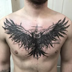 a man's chest is covered in black ink with a large bird on it