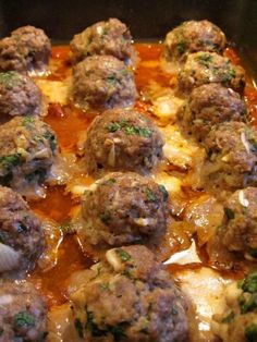 meatballs and sauce in a pan ready to be cooked for the dinner party or appetizer