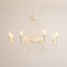 a white chandelier hanging from the ceiling