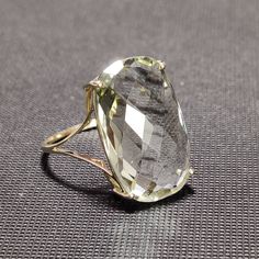 You can choose your own gem in my store. Let me know if you would like to see options Details of the ring Gem: Green Amethyst Gem size & shape: 20x12 mm and Cushion Center Gem weight: 9.70 carat Gold purity: 14K (58.33% approx.) Gold weight: 1.48 grams total weight of ring: 3.42 grams Fine briolette cut Green Amethyst cushion shape gemstone ring set in solid 14K yellow gold. The Gold purity is guaranteed and it comes with authentic 14 kt gold hallmark. Since these Rings are handmade, Size Cu Formal Faceted Amethyst Ring Fine Jewelry, Elegant Yellow Gold Green Amethyst Rings, Elegant Faceted Amethyst Ring For Wedding, Elegant Faceted Amethyst Wedding Ring, Yellow Gold Green Amethyst Ring For Anniversary, Faceted Crystal Ring Fine Jewelry For Formal Occasions, Faceted Crystal Ring For Formal Events, Anniversary Green Amethyst Ring In Yellow Gold, Formal Faceted Crystal Ring Fine Jewelry