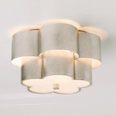 a modern light fixture with multiple shades of grey