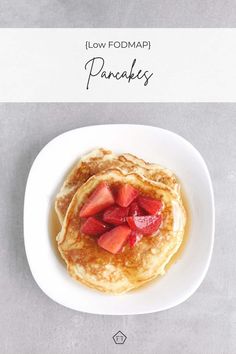 two pancakes with strawberries on top and the words low fodmap pancakes above them