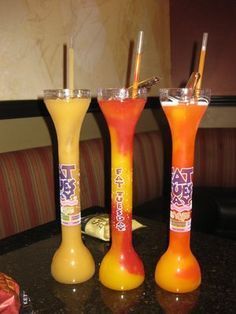 three tall drinks sitting on top of a table