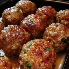 meatballs with sauce and parsley in a pan