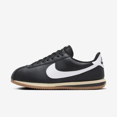 You spoke. We listened. Based on your feedback, we've revamped the original Cortez while maintaining the retro appeal you know and love. This version has a wider toe area and firmer side panels, so you can comfortably wear them day in and day out without any warping. Cortez fans—this one’s for you. Nike Retro Leather Sneakers, Retro Nike Leather Sneakers, Nike Retro Black Sneakers, Classic Black Sneakers With Rubber Toe Cap, Modern Black Sneakers With Rubber Toe Cap, Retro Black Sneakers With Gum Sole, Retro Black Leather Sneakers, Black Vintage Sneakers With Rubber Heel Cap, Classic Black Sneakers With Gum Sole