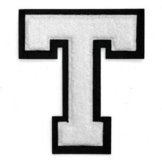 the letter t is made out of felt and has black trimmings on it