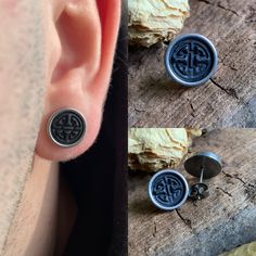 two earring designs are shown next to each other on a piece of drift wood