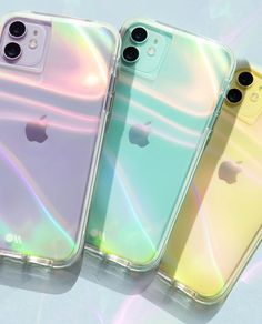 three iphones with iridescent cases sitting next to each other