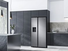 a large stainless steel refrigerator in a modern kitchen