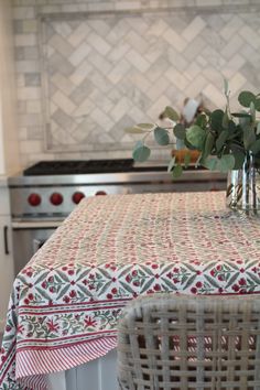 a kitchen table covered with a red and white cloth