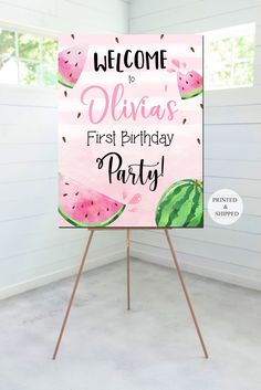 a welcome sign with watermelon slices on it and the words, welcome to julia's first birthday party