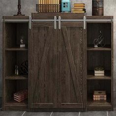 a bookcase with sliding doors and books on top