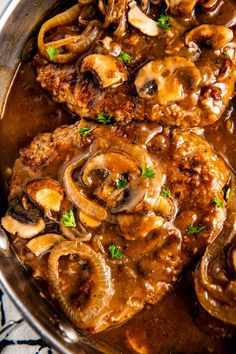 meat with mushrooms and gravy in a skillet