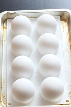 an egg tray with nine eggs in it