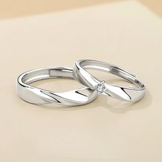 Our Matching Engravable Matching Swirl Wedding Rings for Two is an open ended/adjustable size anti-allergic jewelry set. Personalize the rings with names or any text of your choice in local languages and unique symbols to make it a romantic Christmas and Valentines gift for men and women. Material: White Gold Plated 92 Silver Couple Rings For Wedding On Valentine's Day, Valentine's Day Silver Wedding Couple Rings, Adjustable Silver Couple Rings For Valentine's Day, Simple White Gold Couple Rings For Anniversary, White Gold Couple Rings With Simple Design For Anniversary, Silver Couple Rings For Anniversary With Simple Design, Silver Couple Rings With Simple Design For Anniversary, Wedding Rings For Couples With Open Ring Style, Couples Wedding Rings Open Ring Style