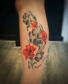 a woman's leg with flowers painted on it