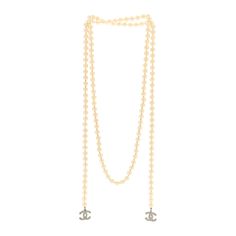 This is an authentic CHANEL Pearl CC Wrap Around Necklace in Light Gold. This stylish necklace is crafted of resin pearls and features a silver Chanel CC logo with tiny resin pearls at each end. Chanel Pearl, Chanel Necklace, Chanel Pearls, Gold Chanel, Stylish Necklace, Chanel Jewelry, Cc Logo, Wrap Around, Pearl Necklace