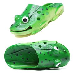 a pair of green shoes with eyes and mouth on the bottom, one is shaped like a frog's head