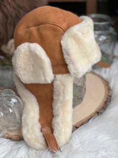 Follkee Unisex 100% Sheepskin Aviator Hat Wool Lined Handcrafted Luxury Original 100% sheepskin bomber style, delivers classic trendy look. Key features: Comfy, Cool, Stylish, Trendy, & Warm, Wind Protection We offer 3 sizes: measurements for head circumference Size S - 46cm- 51cm or 18in to 20in Size M - 52.5cm-59cm or 21 in to 23 inch Size L - 60cm -65cm or 23.5 in to 25.5 inch - Since this is all natural product color/shade might slightly vary, however we make every possible effort to match l Apocalyptic Accessories, Roblox Accessories, Ginger Brown, Sheepskin Throw, Aviator Hat, Wind Protection, Pocket Books, Man Hat, Fashion Life