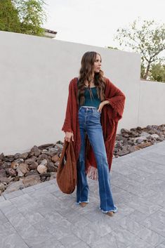 Women's Oversized Frayed Cardigan Open Bohemian Ruana Wrap yourself in playful bohemian vibes with our Open Bohemian Ruana. The oversized fit and frayed fringe detail add a touch of quirkiness to any outfit. Plus, it's one size fits all for easy and cute styling. Perfect for those who don't take fashion too seriously. (Wink!) Details Available in size: One size Available in colors: Navy, Rust, and Brown Long sleeves Open front Frayed fringe detail Open knit detail Oversized Sizing One size fits Raw Hem Flare Jeans, Ruana Wrap, Bohemian Vibes, Ribbed Crop Top, Ribbed Knit Top, Open Knit, Denim Outfit, Black Crop Tops, Denim Shop