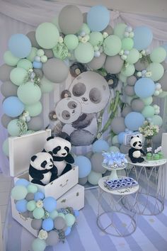 there are balloons and pandas in the room